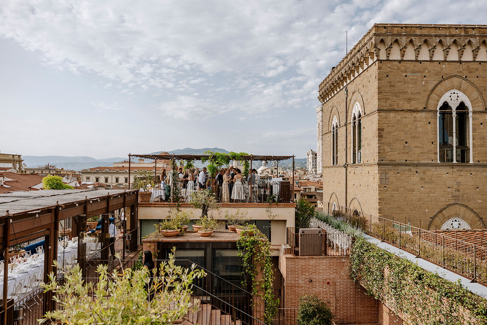 Angel Roofbar aerial view — rooftop set for a wedding with the Duomo beside it